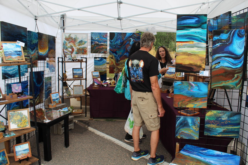 Buena Vista-based painter Phyllis Manning sells her work during the Golden Fine Arts Festival Aug. 20 in downtown Golden.